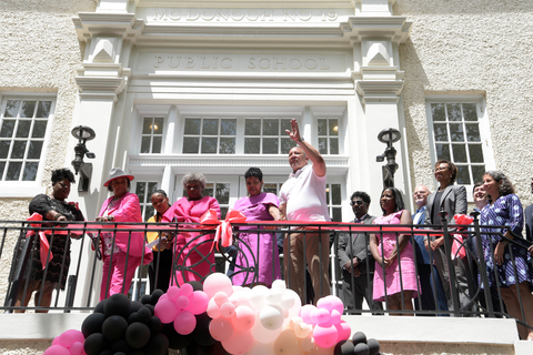 In the foreground, the women in pink, from left to right, Gail Etienne, Leona Tate, Tessie Prevost, who desegregated McDonogh No. 19 in 1960 at the age of 6, and National Urban League President and CEO Marc Morial cut the ribbon at the renovated building, now home to affordable apartments for seniors and an anti-racism center. (Photo: Business Wire)