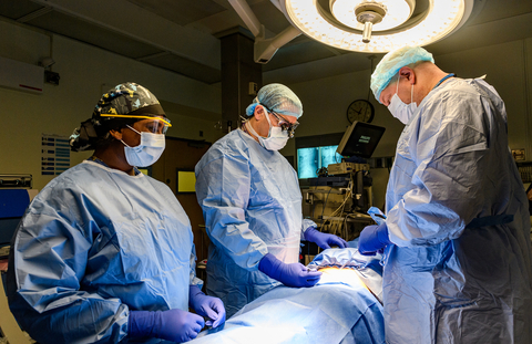 Surgeons Jeff Silber (second from left) and David Essig (right) perform spine surgery at Long Island Jewish Medical Center. Credit Northwell Health.