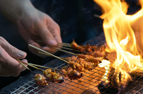 GOOD Meat cultivated chicken satay being cooked over charcoal (Photo: Eat Just, Inc.)