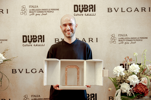Nima Nabavi, winner of the Bulgari Contemporary Art Award, with the trophy (Photo: AETOSWire)