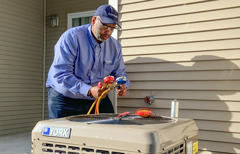 Corvias team member installs a new energy-efficient HVAC system as part of the $325 million Solutions Investment by Corvias to enable energy resilience and modernization across six U.S. Army installations. (Photo: Business Wire)