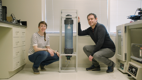 Capra Biosciences co-founders Elizabeth Onderko, CEO, and Andrew Magyar, chief technology officer, pose with their bioreactor technology. (Photo: Business Wire)