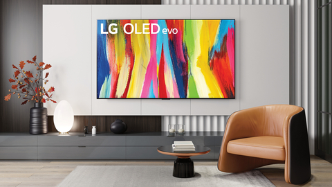 The 4K Ultra High Definition OLED Smart TV C2 Series, available at Newegg, is featured in a lifestyle room setting. The 2022 LG TV model has an OLED Evo panel, refined design, A9 Gen 5 AI processor 4K, home cinema (Dolby Vision/Dolby Atmos/Filmmaker Mode), ultimate gaming (G-SYNC compatible, FreeSync Premium, VRR. 4K @ 120Hz) and a brightness booster. (Photo: Business Wire)