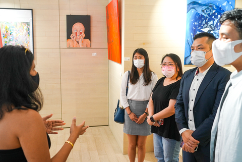 Hello Colour Founder and Creative Director, Sravya Attaluri speaks to a group of attendees at the "Journey to Self" Exhibition in Hong Kong. (Photo: Business Wire)
