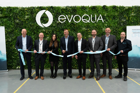 original Evoqua team cutting the ribbon at the grand opening event (L-R): Steffen Lange, VP and General Manager of Evoqua's Disinfection Division, Phil Walsh, Plant Manager, Kelly Van Marle, Senior Quality Control Technician, Ron Keating, Chief Executive Officer, Hervé Fages, Executive Vice President and Applied Product Technologies Segment President, Sean Zyra, Sr. Director of Manufacturing Engineering and Quality, Frans Conradie, Operations Director, and Dave Robinson, Warehouse Supervisor. (Photo: Business Wire)