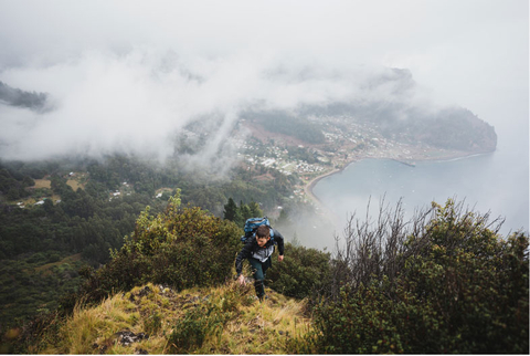 A Work for Humankind volunteer explores Robinson Crusoe Island, Chile (Photo: Business Wire)