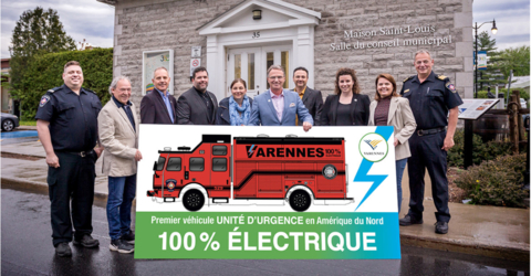 Firefighters and city officials pose with a drawing of their all-electric Vector™ Rescue Decon truck for the City of Varennes Fire Safety Service in Quebec; the first Rescue truck using the first fully electric North America- style fire truck design. (Photo: Business Wire)