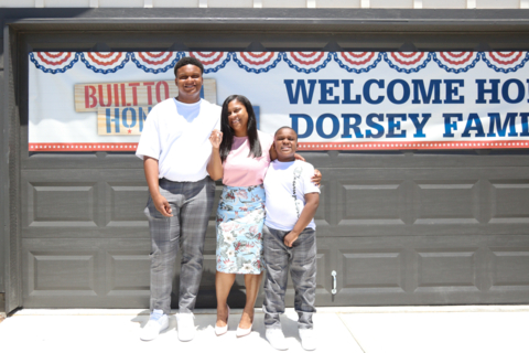 U.S. Army Specialist Kisha Dorsey and family with the keys to their new mortgage-free home in the Windrow community. (Photo: Business Wire)