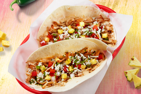 The Piña Carnitas Taco is available at Fuzzy's Taco Shop from Wednesday, July 13 through Sunday, August 21. The scratch made taco is prepared with the new shredded carnitas and topped with made-in-house roasted jalapeño garlic sauce and pineapple pico, feta, and cilantro on a warm flour tortilla. (Photo: Business Wire)