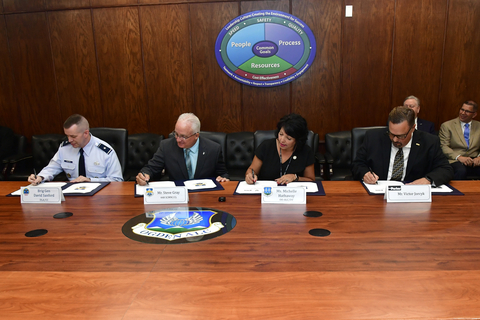 Senior leaders during the ceremonial signing of a performance-based logistics contract June 27, 2022, at Hill Air Force Base, Utah. Under the agreement, Parker Aerospace will provide supply chain, engineering and field service support at the Ogden Air Logistics Complex covering hydraulic equipment for five Air Force platforms. Pictured from left are: Brig. Gen. David Sanford, Defense Supply Center Richmond and Defense Logistics Agency Aviation commander, Steve Gray, 448th Supply Chain Management Wing director, Michelle Hathaway, Ogden ALC vice director, and Victor Jorcyk, Parker Aerospace customer support operations vice president. (U.S. Air Force photo by Todd Cromar)