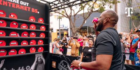T-Mobile's yearlong Rage Against Big Internet Tour continues with Rage Cage, giving customers the chance to strike out Big Internet in a custom pitching cage at the 2022 MLB All-Star weekend. (Photo: Business Wire)
