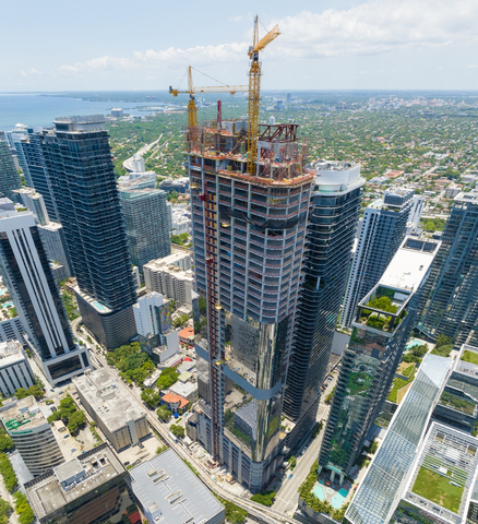 Cranes working to complete 830 Brickell. Sidley has signed a 60,000 square-foot lease at the 55-story tower. (Photo: Business Wire)