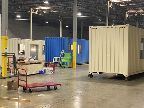 original Picture of containers within the warehouse (Photo: Business Wire)