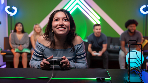 Tori Vasquez is transfixed on an action video game while competing on “The Gamer Lounge,” a short-form reality-competition series from Newegg Studios. She is using a Thrustmaster ESWAP X Pro Controller while playing on an Xbox Series S. (Photo: Business Wire)