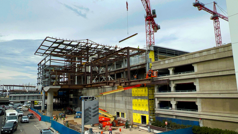 thumbnail The last structural steel for an APM station was lifted by crane and then attached by iron workers. (Photo: Business Wire)