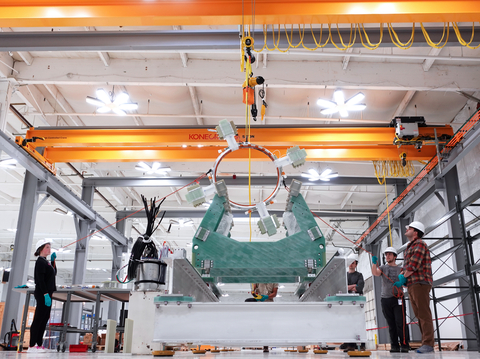 Helion team members assembling electromagnetic coil on fusion generator test (Photo: Business Wire)