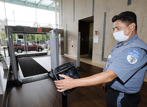 A Northwell Health security officer monitors Evolv Express at the entrance to Long Island Jewish Medical Center in New Hyde Park. Credit Northwell Health.
