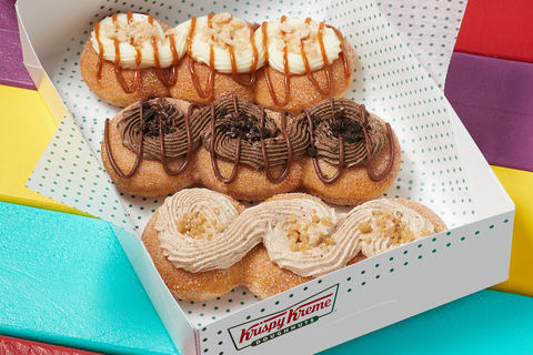 Beginning Sept. 5, fans can experience first-of-its-kind Krispy Kreme creations inspired by the cinnamon-sugary flavor of churros (Photo: Business Wire)