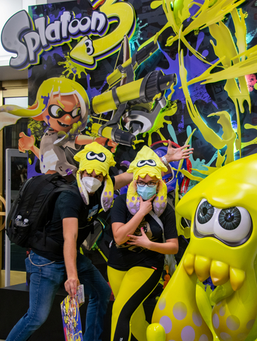 In this photo provided by Nintendo of America, Noah H. and Jennifer P. from Queens, NY celebrate the launch of the Splatoon 3 game for the Nintendo Switch family of systems. During the launch event at the Nintendo NY store in Rockefeller Plaza, attendees reveled with splat-tastic excitement in the lead up to the midnight release, and the store itself – plastered in vibrant visuals straight out of Splatsville – had style to match.