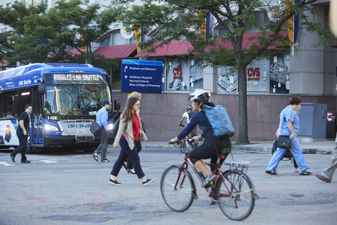 Boston's Longwood Collective operates a fleet of 37 LMA Shuttle buses serving the internationally renowned Longwood Medical and Academic Area (LMA). Promotion by the Longwood Collective and its members of mass transit, carpooling, biking, and walking have achieved a major "mode shift" decrease in people using single-occupancy vehicles to get to and from the LMA--even as employment and patient visits in the district have soared since 2000. (Photo: The Longwood Collective)