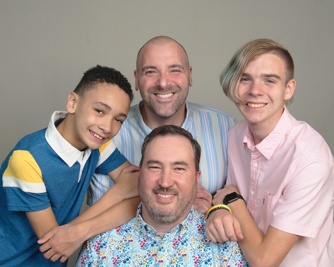 Zoetis' 2022 Working Parents of the Year are A.J. Edge (top center) and Daniel Edge (bottom center). They are pictured here with their sons, Peyton, 12 (left) and Jackson, 17 (right). Source: Zoetis
