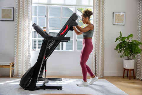 The Bowflex® BXT8J treadmill’s SoftDrop™ folding system reduces the machine’s footprint by more than 40% and transport wheels make it easy to move and store around the home. (Photo: Business Wire)