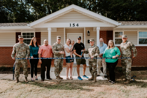 Corvias and local U.S. Army command welcome the Wise family home to a newly renovated duplex in the Munson Heights neighborhood. Pictured left to right: CSM Christopher Doss, Garrison CSM; Melissa Bryson, Corvias Operations Director; Anonymous; COL Robert Holcombe, Garrison Commander; Tiffani Wise; Aiden Wise; SSG Jared Wise; MG Michael McCurry, Commanding General; Rodney (Rob) Smith, Corvias Facilities Director; Jessica Cunningham, Corvias Leasing & Resident Manager; and CSM James Wilson, Installation CSM (Photo: Business Wire)