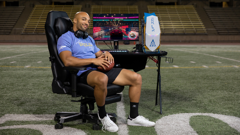 Austin Ekeler of the Los Angeles Chargers is shown on a football field with the new limited edition EKLR, his signature gaming PC, and a GIGABYTE gaming monitor. Newegg is offering the PC and a GIGABYTE monitor together as a bundle while supplies last. (Photo: Newegg)