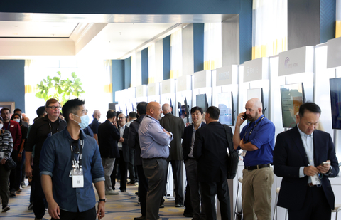 Attendees of Samsung Foundry Forum 2022 are gathered around the customer booths. (Photo: Business Wire)