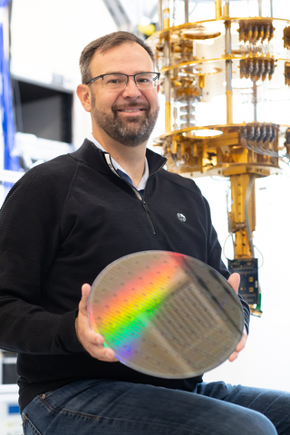 Intel's director of Quantum Hardware, James S. Clarke, holds a fully processed 300 millimeter silicon spin qubit wafer. (Credit: Intel Corporation)