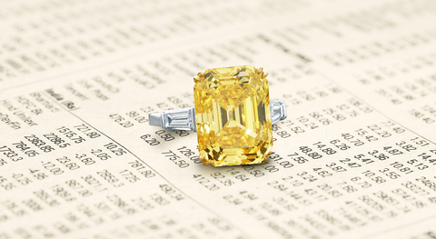 The Golden Dahlia features an 11.74 carat fancy vivid yellow diamond with a VVS1 clarity grade, set in a platinum ring setting with colorless tapered baguettes. Available for $300/share with a market capitalization of $1.5M. (Photo: Business Wire)