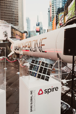 Spire's model satellite sits in front of a full-scale LauncherOne in Times Square, New York, January 2022, Courtesy Virgin Orbit
