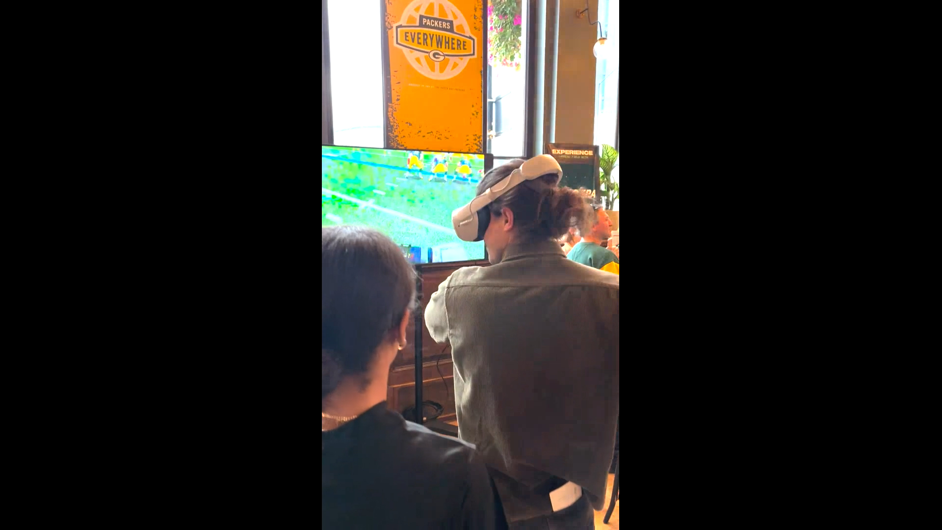 Packers fans demo NFL PRO ERA at a London-based bar prior to the Packers-Giants matchup, courtesy of StatusPRO.