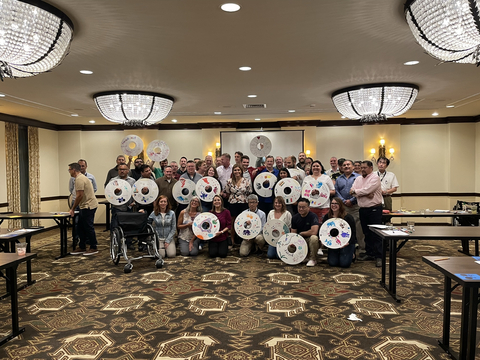 The Teijin Automotive Technologies EH&S and Operations teams show off their wheel spoke guards, which will be donated to wheelchair users around the world. (Photo: Business Wire)