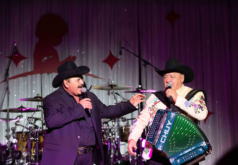 Founder of Los Huracanes del Norte Eraclio “Rocky” Garcia with his brother Jesus “Chuy” Garcia on the accordion perform at Promesa y Ezperanza. (Photo: Business Wire)