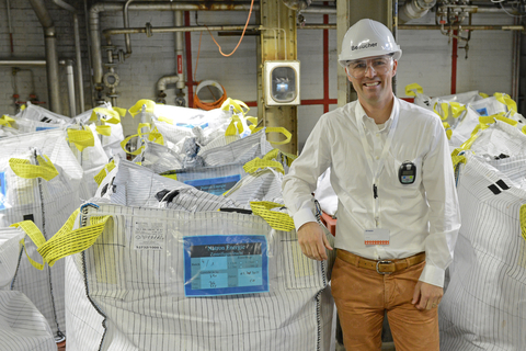 Natron Energy CEO Colin Wessells stands next to battery-grade Prussian blue at Arxada's facility in Visp, Switzerland. The Prussian blue supplied by Arxada will be transformed into UL-listed sodium-ion battery products at Natron's Holland, Michigan factory in the United States. (Photo: Business Wire)