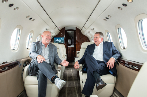 Jim Segrave, Chairman and CEO of flyExclusive (left) and Ron Draper, President and CEO of Textron Aviation (right). (Photo: Business Wire)