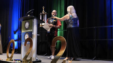 Joshua Miller of Green Valley Window Tinting accepting his 1st Place Trophy and $10,000 for winning the Architectural Window Film division. (Photo: Business Wire)