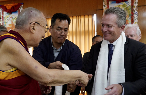 Dr. Hans Keirstead shakes hands with His Holiness the Dalai Lama at His private residence in Dharamsala, India. (Photo: Business Wire)