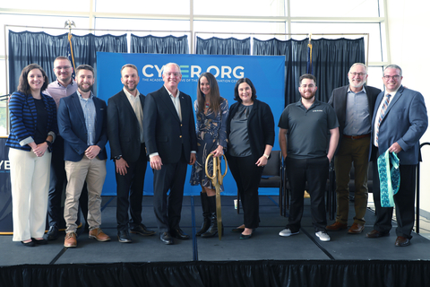 Louisiana Governor John Bel Edwards, Cybersecurity Infrastructure Security Agency (CISA) Director Jen Easterly, and members of the CYBER.ORG team pose on stage following a press conference announcing that the CYBER.ORG Range, a no-cost, safe, virtual environment for K-12 students to learn cybersecurity skills, will be expanded to students nationwide. (Photo: Business Wire)