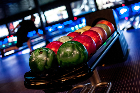 PINSTACK offers 28-state-of-the art bowling lanes with lane-side dining. The Modern American restaurant, fully-stocked bar, game room and indoor attractions complete the unique dining and entertainment experience for friends, family, corporate and group events. (Photo: Business Wire)