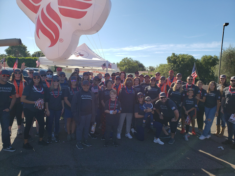 The University of Phoenix Veteran's Day Parade entry features a large balloon and a team of veteran employees, family members and friends. (Photo: Business Wire)