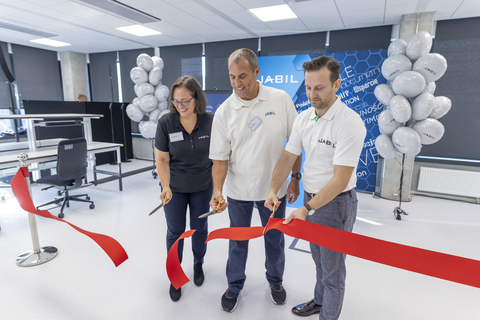 Pictured at the official opening of Jabil’s new Design Centre in Wroclaw, Poland are (l-r): Jabil Vice President for Technology April Butterfield, Jabil Vice President for Business Development Les Pawlak and Jabil Design Engineering Manager Michal Drwiega. The new design center will develop leading edge technologies for multiple industries including the automotive and healthcare sectors. (Photo: Business Wire)