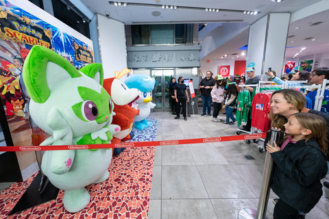 In this photo provided by Nintendo of America, Valentina P. and her mother Karina P. of New York excitedly meet the newest partner Pokémon, as Nintendo New York in Rockefeller Plaza celebrates the upcoming arrival of Pokémon Scarlet and Pokémon Violet. Pokémon Scarlet and Pokémon Violet are the newest entries in the Pokémon RPG series, where players may explore a wide-open world at their own pace and traverse land, water and air. The games launch exclusively for the Nintendo Switch family of systems on Nov. 18. (Photo: Business Wire)