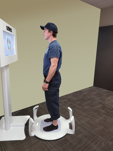 A Denver Firefighter getting his feet scanned with an Albert 2 Pro. (Photo: Business Wire)