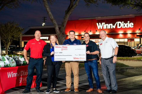SEG presented a $100,000 donation to the USO in support of the organization's mission to strengthen America's military members by keeping them connected to family, home and country throughout their service. The donation was presented during a Winn-Dixie Gives thanksgiving food donation event in support of USO families in Jacksonville, FL. (Photo: Business Wire)