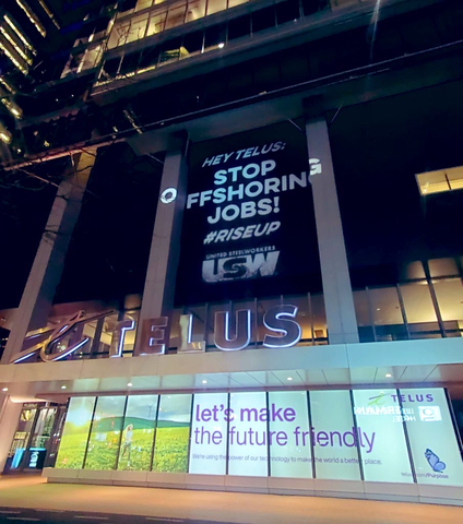 The United Steelworkers union shines a light on Telus' outsourcing of Canadian jobs, at the Telus tower, downtown Toronto.(Photo: Business Wire)