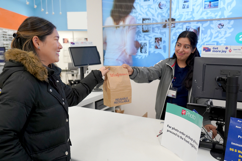 A courier picks up a 24-Hour Same Delivery order from Walgreens. (Photo: Business Wire)