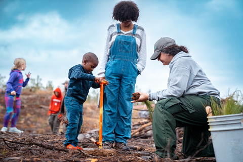 The community shows support for Hoke Community Forest by planting Longleaf seedlings on Saturday (12/3). (Photo: Business Wire)