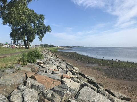 A view of the Long Wharf district in New Haven, Conn., with Interstate 95 at left and Long Island Sound at right. The City of New Haven, with support from GZA GeoEnvironmental Inc. and other partners, has secured more than $240 million in federal funding to upgrade resiliency, flood protection, and public access throughout the district, including a "living shoreline." (Photo: Business Wire)